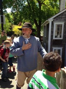 Leo the Miller of the Jenney Museum speaks to students on a tour of Plymouth.