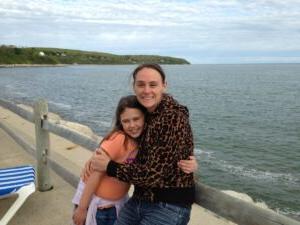 A mother and daughter stand by the bay in Plymouth, MA